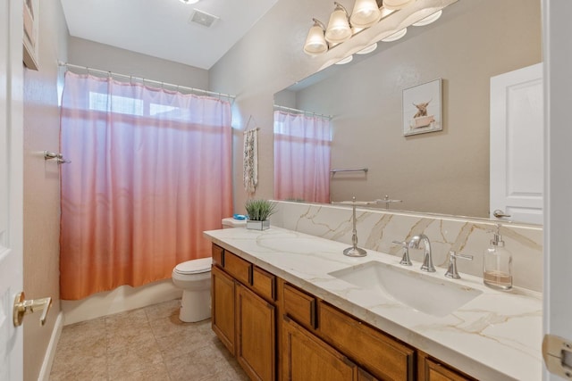 bathroom with toilet, visible vents, and vanity