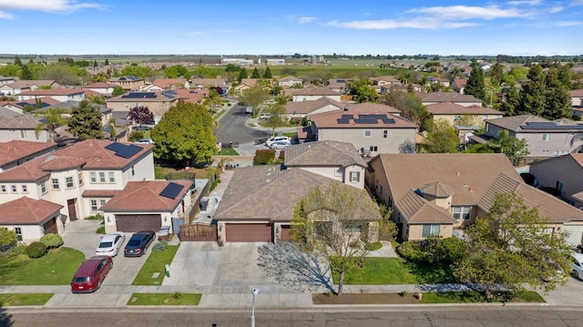 birds eye view of property with a residential view