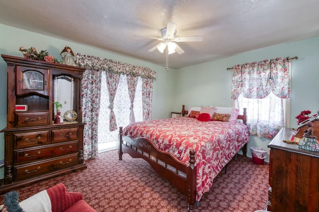 bedroom featuring multiple windows, carpet, and ceiling fan