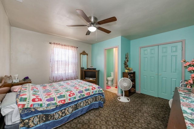 carpeted bedroom with a closet, a ceiling fan, and ensuite bath