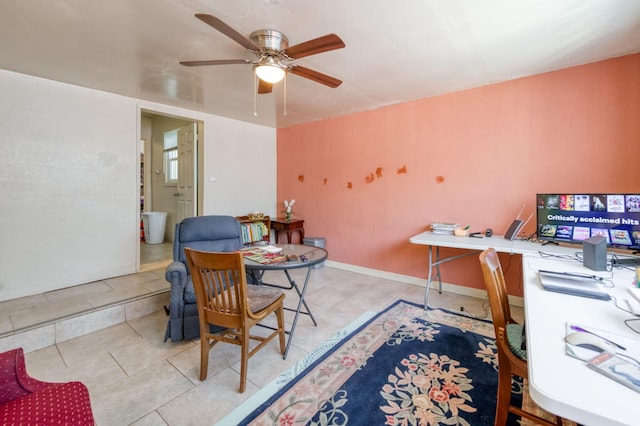 office area with ceiling fan and tile patterned flooring