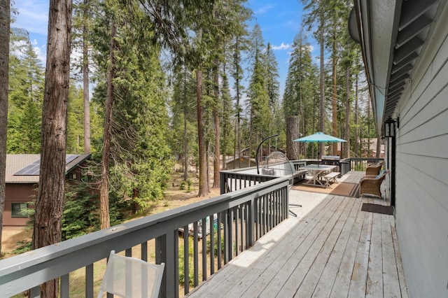 deck with outdoor dining area