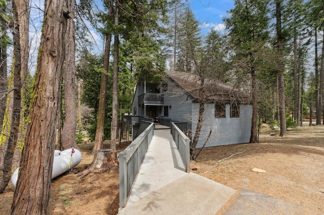view of front of home featuring a balcony