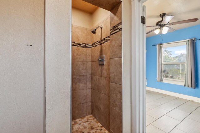 555 S Sierra Vista Ave, Fresno, CA 93702 - bathroom featuring a ceiling fan, a tile shower, and tile patterned flooring