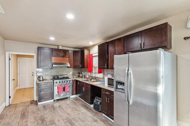 555 S Sierra Vista Ave, Fresno, CA 93702 - kitchen featuring extractor fan, backsplash, appliances with stainless steel finishes, and light countertops