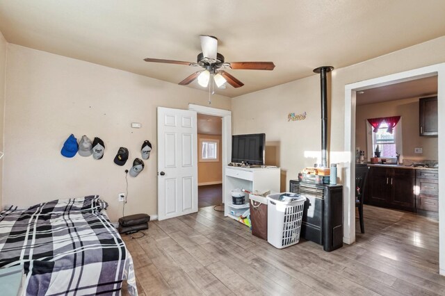 555 S Sierra Vista Ave, Fresno, CA 93702 - bedroom with ceiling fan and light wood-style floors