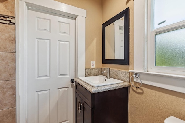 555 S Sierra Vista Ave, Fresno, CA 93702 - half bathroom with a textured wall and vanity