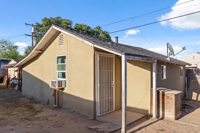 555 S Sierra Vista Ave, Fresno, CA 93702 - view of home's exterior with stucco siding, fence, and a shingled roof