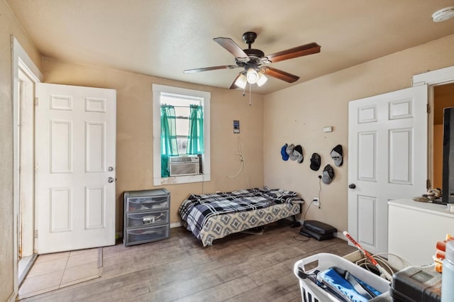 555 S Sierra Vista Ave, Fresno, CA 93702 - bedroom featuring a ceiling fan, wood finished floors, and cooling unit