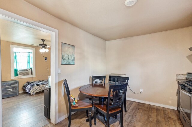 555 S Sierra Vista Ave, Fresno, CA 93702 - dining space with cooling unit, a ceiling fan, wood finished floors, and baseboards