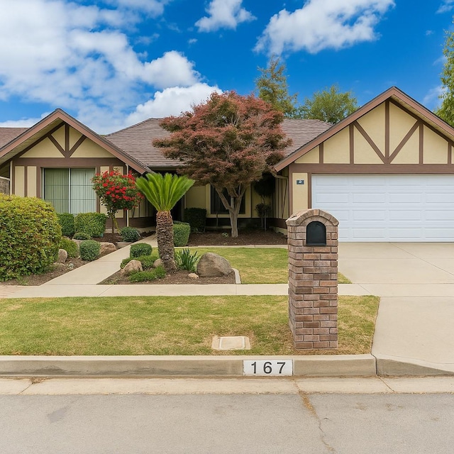 167 W Quincy Ave, Fresno, CA 93711 - view of front facade featuring a front yard, a garage, a shingled roof, concrete driveway, and stucco siding