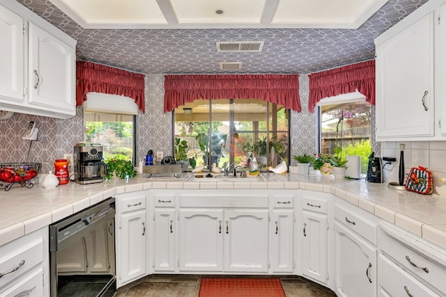 167 W Quincy Ave, Fresno, CA 93711 - kitchen featuring tasteful backsplash, white cabinets, dishwasher, a sink, and visible vents