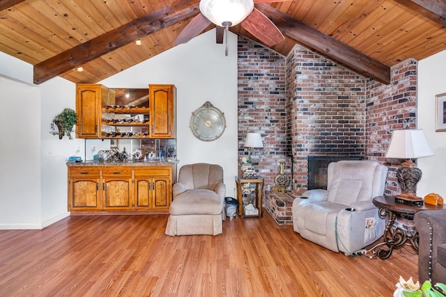 167 W Quincy Ave, Fresno, CA 93711 - sitting room with light wood-style floors, lofted ceiling with beams, baseboards, and wooden ceiling