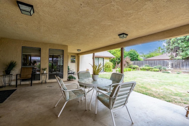 167 W Quincy Ave, Fresno, CA 93711 - view of patio with outdoor dining space and a fenced backyard
