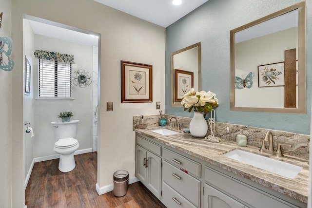 167 W Quincy Ave, Fresno, CA 93711 - full bathroom featuring wood finished floors, toilet, double vanity, and a sink