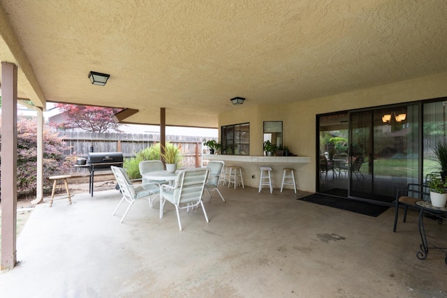 167 W Quincy Ave, Fresno, CA 93711 - view of patio featuring fence, area for grilling, and outdoor dry bar