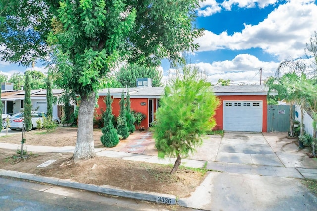 3336 N Lafayette Ave, Fresno, CA 93705 - view of front of home featuring driveway, fence, and an attached garage