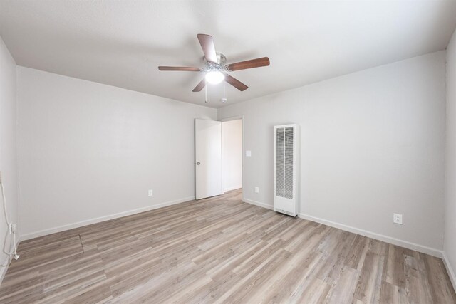 3336 N Lafayette Ave, Fresno, CA 93705 - empty room featuring baseboards, ceiling fan, light wood finished floors, and a heating unit