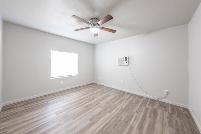 3336 N Lafayette Ave, Fresno, CA 93705 - unfurnished room with baseboards, a ceiling fan, light wood finished floors, and a wall mounted AC