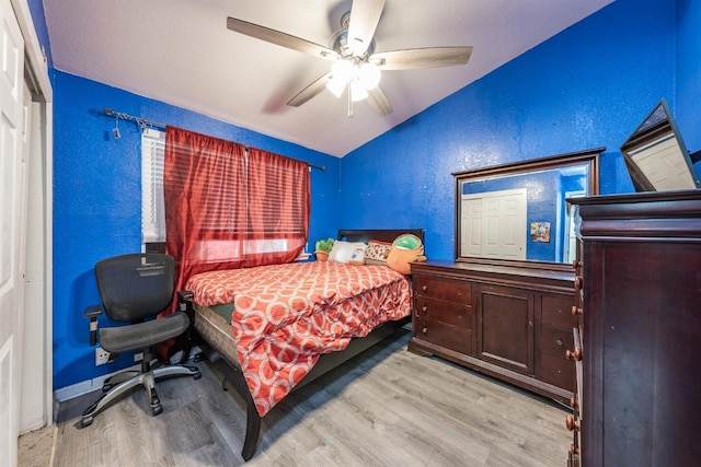 3336 N Lafayette Ave, Fresno, CA 93705 - bedroom with wood finished floors, a ceiling fan, lofted ceiling, and a textured wall