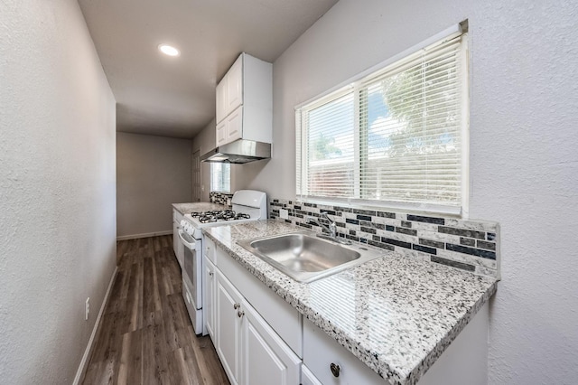 3336 N Lafayette Ave, Fresno, CA 93705 - kitchen with gas range gas stove, white cabinetry, dark wood-style flooring, a sink, and baseboards