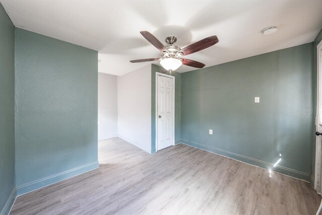 3336 N Lafayette Ave, Fresno, CA 93705 - unfurnished room with baseboards, wood finished floors, and ceiling fan
