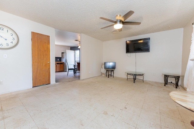 603 E Compton Ave, Pixley, CA 93256 - living area with a ceiling fan and a textured ceiling