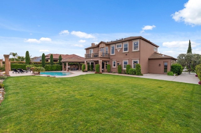 4918 W Bluff Ave, Fresno, CA 93722 - back of property with a lawn, a gazebo, and a patio area