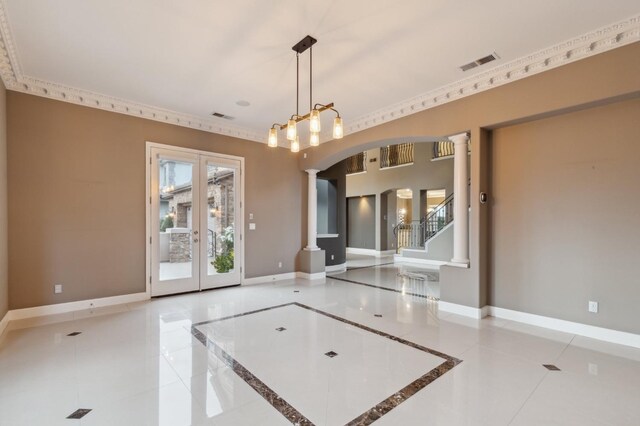 4918 W Bluff Ave, Fresno, CA 93722 - tiled spare room featuring arched walkways, visible vents, decorative columns, and baseboards