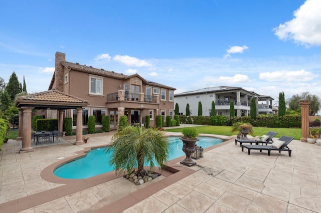 4918 W Bluff Ave, Fresno, CA 93722 - outdoor pool with a lawn, a patio, and a gazebo