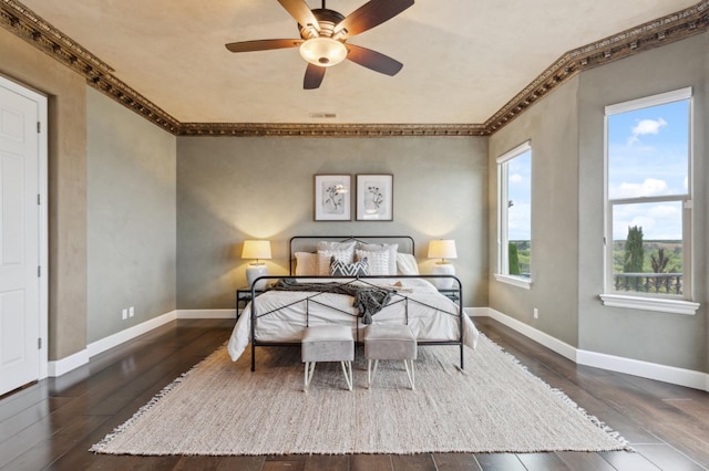 4918 W Bluff Ave, Fresno, CA 93722 - bedroom featuring wood-type flooring, ceiling fan, visible vents, baseboards, and ornamental molding