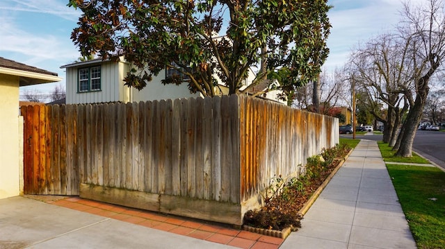 523 W Yosemite, Madera, CA 93637 - view of side of property featuring board and batten siding and fence