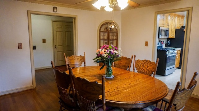 523 W Yosemite, Madera, CA 93637 - dining room featuring baseboards, a ceiling fan, and wood finished floors