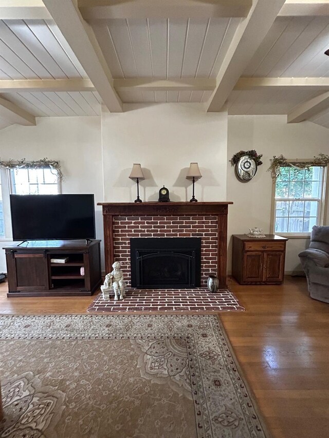 523 W Yosemite, Madera, CA 93637 - living area featuring wood ceiling, vaulted ceiling with beams, a brick fireplace, and wood finished floors