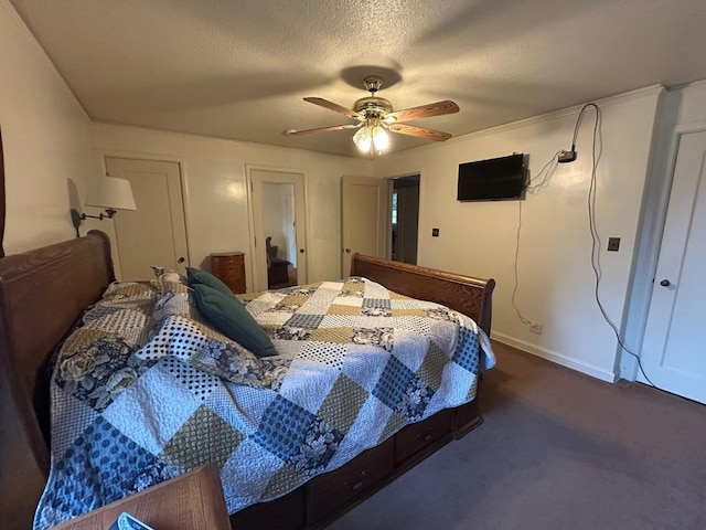 523 W Yosemite, Madera, CA 93637 - bedroom featuring baseboards, ceiling fan, dark carpet, and a textured ceiling