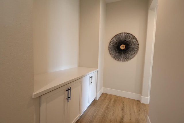 details featuring baseboards and wood finished floors