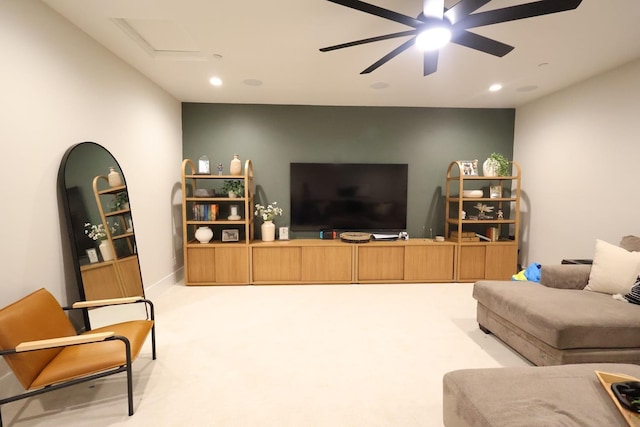 living area featuring attic access, recessed lighting, ceiling fan, and carpet floors