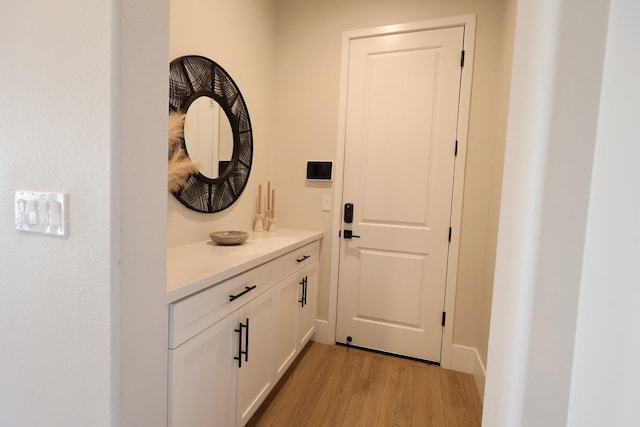doorway to outside with light wood-style floors