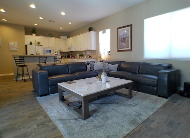 14335 Spyglass Cir, Chowchilla, CA 93610 - living area with wood finished floors, recessed lighting, and baseboards
