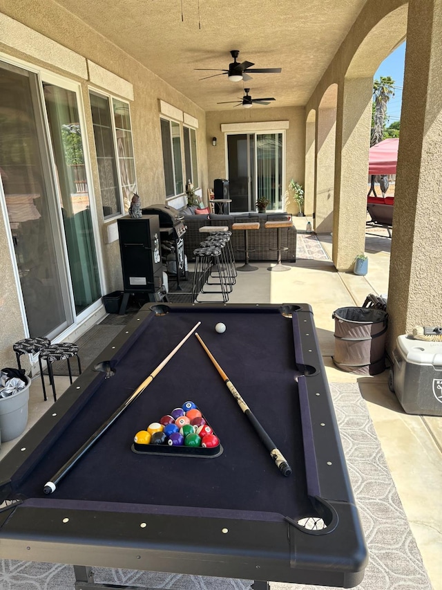 14335 Spyglass Cir, Chowchilla, CA 93610 - recreation room with billiards, ceiling fan, a textured wall, and a textured ceiling