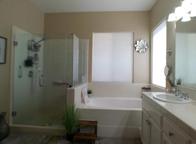 14335 Spyglass Cir, Chowchilla, CA 93610 - bathroom with vanity, a shower stall, and a bath