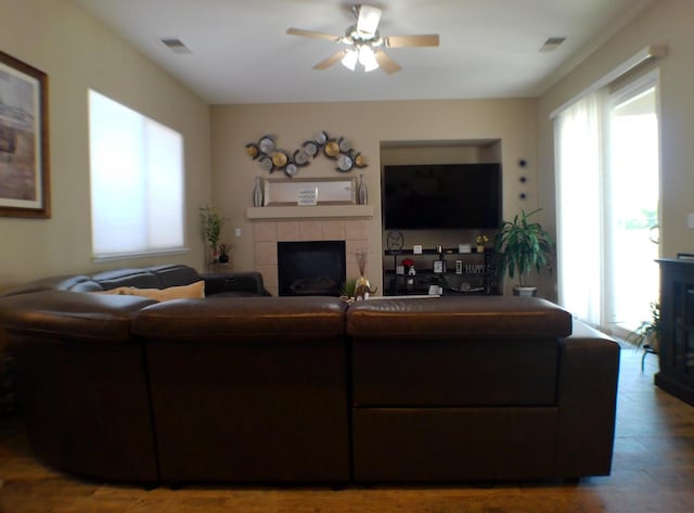 14335 Spyglass Cir, Chowchilla, CA 93610 - living room featuring a fireplace and a ceiling fan