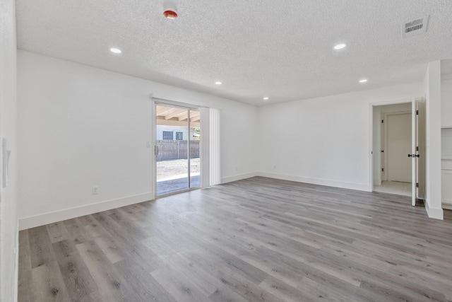 465 W Woods Ave, Tipton, CA 93272 - unfurnished room with a textured ceiling, visible vents, and recessed lighting