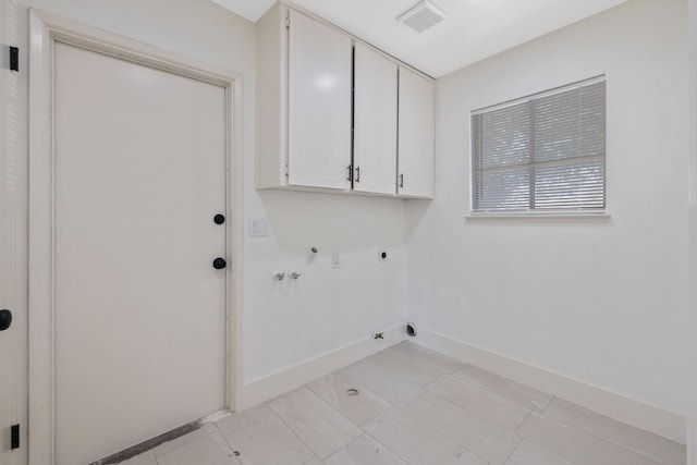 465 W Woods Ave, Tipton, CA 93272 - laundry room with cabinet space, hookup for an electric dryer, gas dryer hookup, washer hookup, and baseboards