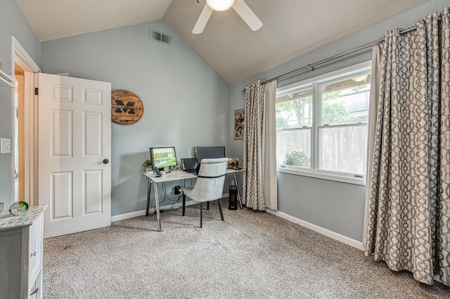 home office with a ceiling fan, visible vents, baseboards, lofted ceiling, and carpet flooring
