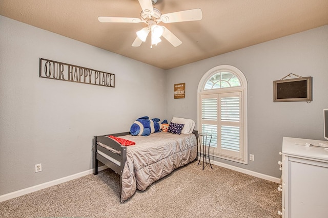 bedroom with baseboards, light carpet, and ceiling fan