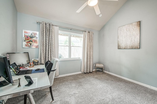 carpeted office featuring ceiling fan, vaulted ceiling, and baseboards