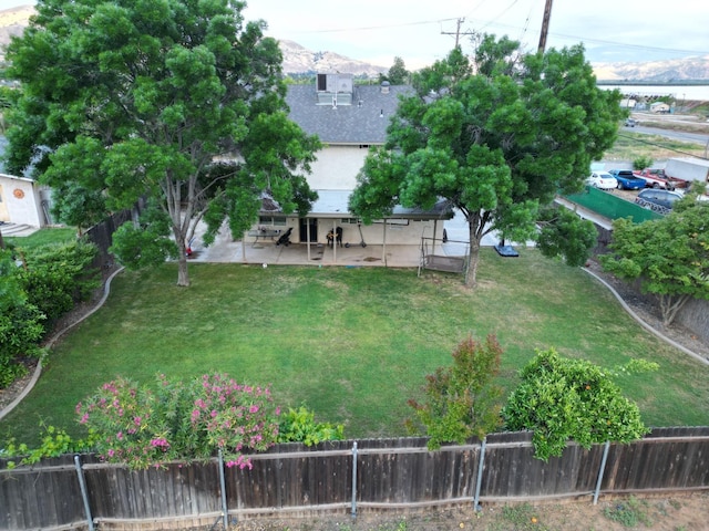 view of yard with a fenced backyard and a patio area