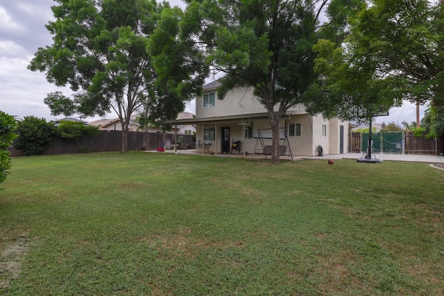view of yard featuring a patio and fence