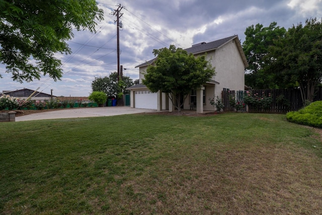 view of side of home featuring a lawn, a garage, fence, concrete driveway, and stucco siding